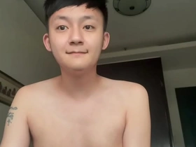 Young Asian man masturbates and ejaculates.