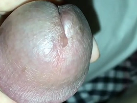 Close-up of an Asian man pleasuring himself and cumming.