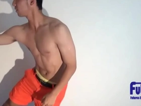 Young and straight sports enthusiast shows off his muscles and short hair.